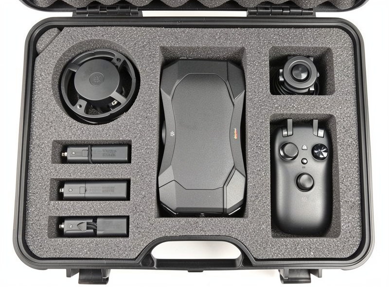 DJI drone, batteries and controller arranged in a foam-lined hard case