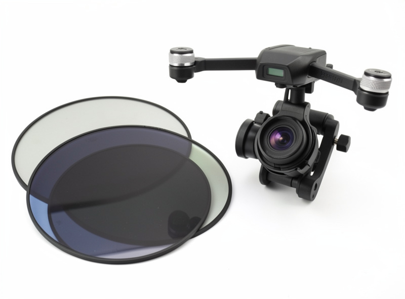 Set of neutral density filters fanned out next to a DJI drone camera gimbal