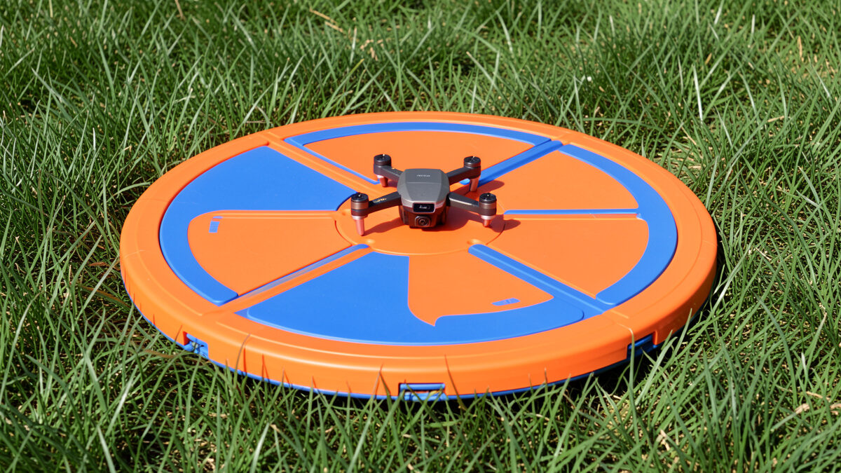 Collapsible drone landing pad on grass
