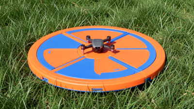 Collapsible drone landing pad on grass