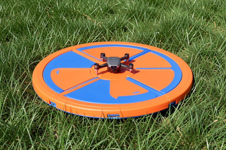 Collapsible drone landing pad on grass